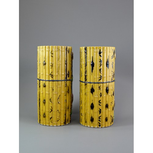429 - A PAIR OF TALL CYLINDRICAL YELLOW BISCUIT ‘BAMBOO’ HAT STANDS, CIRCA 1900
Each carved and painted as... 