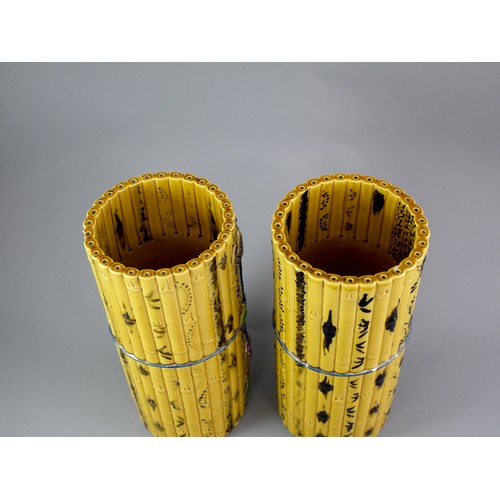 429 - A PAIR OF TALL CYLINDRICAL YELLOW BISCUIT ‘BAMBOO’ HAT STANDS, CIRCA 1900
Each carved and painted as... 