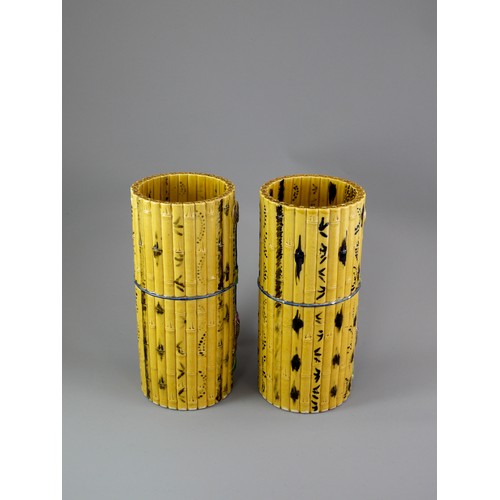 429 - A PAIR OF TALL CYLINDRICAL YELLOW BISCUIT ‘BAMBOO’ HAT STANDS, CIRCA 1900
Each carved and painted as... 