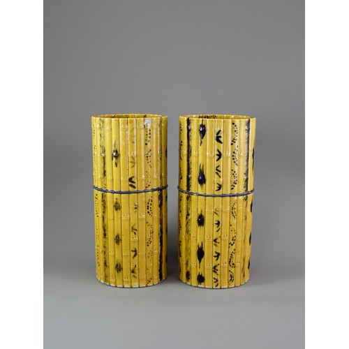 429 - A PAIR OF TALL CYLINDRICAL YELLOW BISCUIT ‘BAMBOO’ HAT STANDS, CIRCA 1900
Each carved and painted as... 