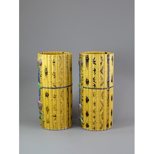 429 - A PAIR OF TALL CYLINDRICAL YELLOW BISCUIT ‘BAMBOO’ HAT STANDS, CIRCA 1900
Each carved and painted as... 
