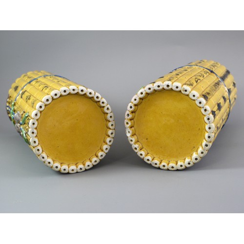 429 - A PAIR OF TALL CYLINDRICAL YELLOW BISCUIT ‘BAMBOO’ HAT STANDS, CIRCA 1900
Each carved and painted as... 