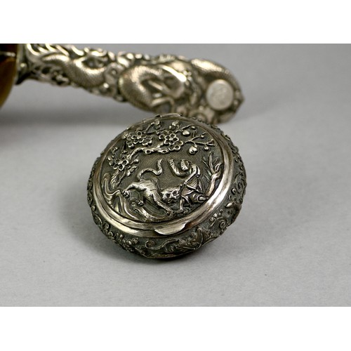 436 - A SILVER TRIPOD TEA STRAINER 
With fine dragon handle in low relief, marked ‘Tuck Chang’, along with... 