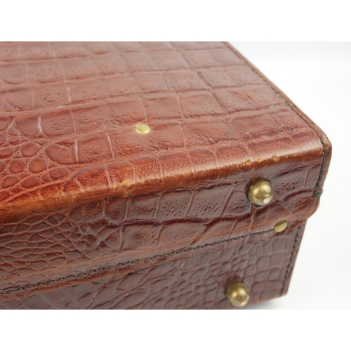 PAPWORTH, A VINTAGE LEATHER FAUX CROCODILE SKIN SUITCASE With brass  escutcheon locks, bearing label