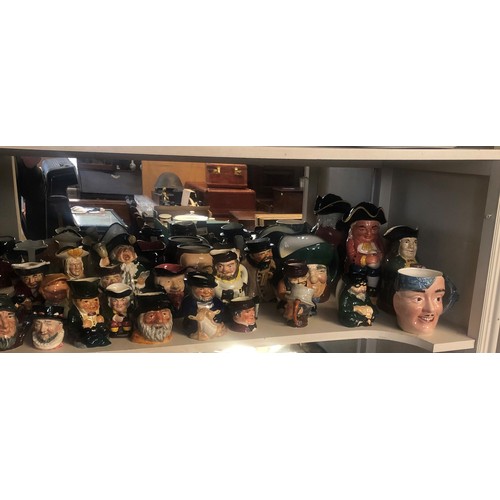 115 - A COLLECTION OF TWENTY-SIX VARIOUS TOBY AND CHARACTER JUGS
To include Beswick, Royal Doulton etc.

C... 