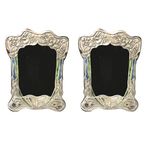 67 - A PAIR OF STERLING SILVER AND ENAMEL ART NOUVEAU STYLE PHOTOGRAPH FRAMES With butterfly decoration.
... 