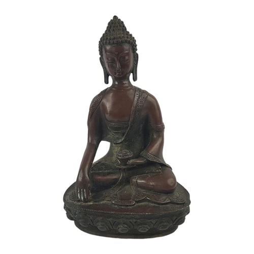 62 - A BRONZE SEATED BUDDHA (ALSO KNOWN AS SHAKYAMUNI BUDDHA)
(h 33cm)

Condition: good