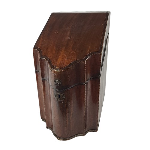 50 - A GEORGE III MAHOGANY KNIFE BOX
The fall front opening to reveal a knife section divided interior, b... 