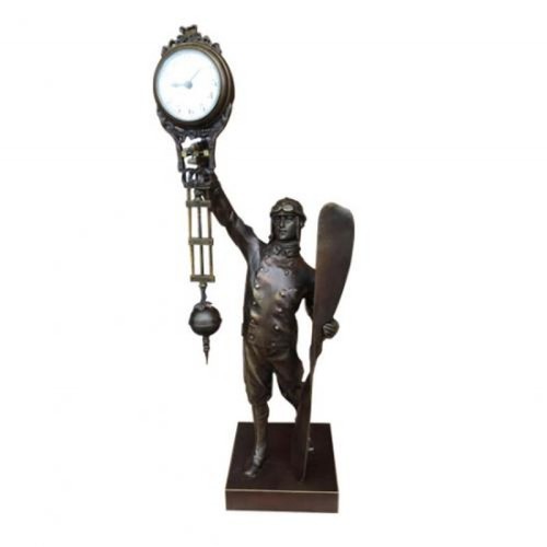 36 - A BRONZE FIGURAL AIRMAN CLOCK 
With swing pendulum.
(h 38cm)

Condition: in working order