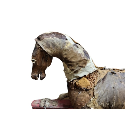 40 - A 19TH CENTURY WOODEN ROCKING HORSE 
Straw filled body with leather.
(h 91cm x length 107cm x w 36cm... 