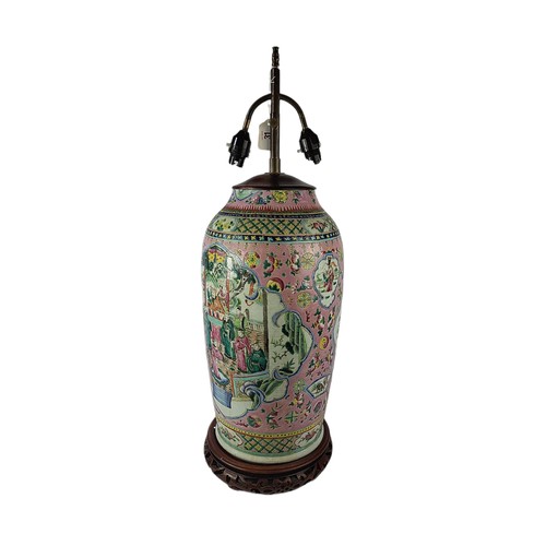 31 - A LARGE FAMILLE ROSE DESIGN CHINESE POTTERY LAMP 
With chinoiserie decorations, on a wooden pierced ... 