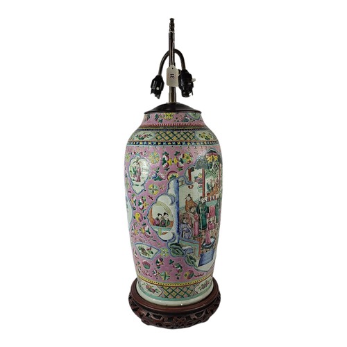 31 - A LARGE FAMILLE ROSE DESIGN CHINESE POTTERY LAMP 
With chinoiserie decorations, on a wooden pierced ... 
