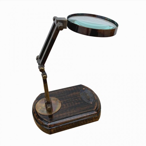 9 - WATTS & SONS LTD, A LIBRARY MAGNIFYING GLASS ON ADJUSTABLE STAND.
(h 30cm)

Condition: good