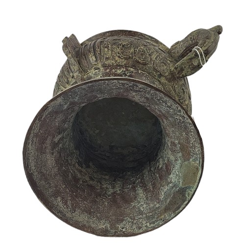 5 - A CHINESE ARCHAIC STYLE BRONZE TWO HANDLED CENSER
Decorated with Chinese symbols.
(h 20cm x 19cm)

C... 