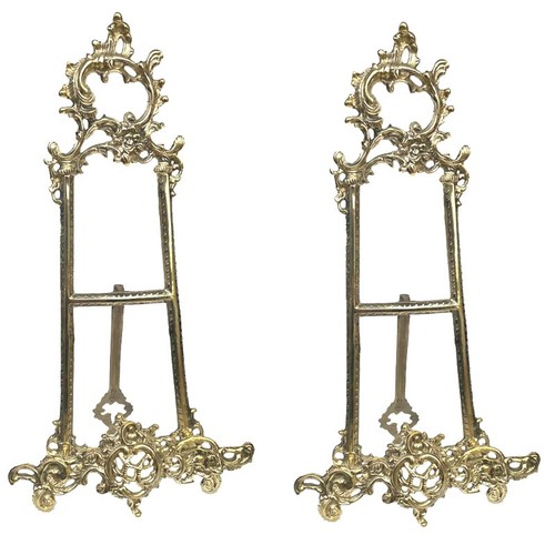 76 - A PAIR OF LARGE ORNATE GILT BRASS EASELS.
(h 43cm) 

Condition: good