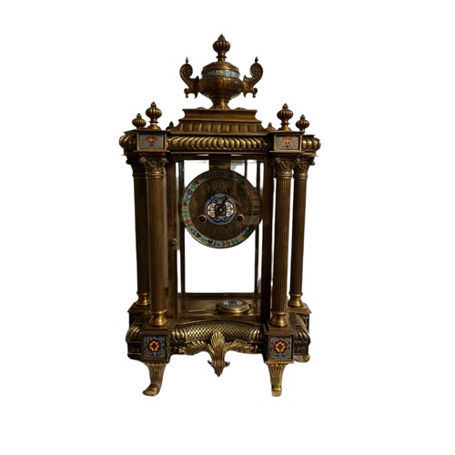 173 - A GLASS CASED BRASS AND CLOISONNÉ CLOCK 
Having ornate columns, complete with pendulum and key.
(h 6... 