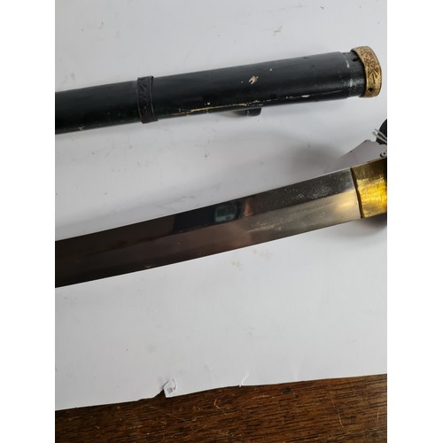 100 - A JAPANESE GUNTO SWORD
Bronze mounts, ebonised wood scabbard.
(length 96cm)

Condition: good, light ... 