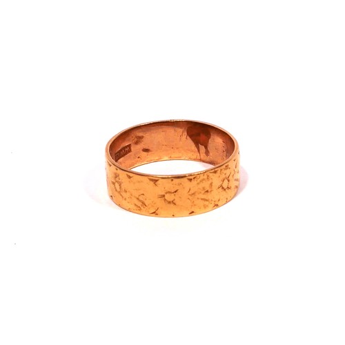 44 - AN EARLY 20TH CENTURY 22CT GOLD WEDDING BAND
With engraved floral decoration.
(size P/Q, approx 5.5g... 