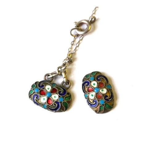 12a - A STERLING SILVER AND ENAMEL RUSSIAN DESIGN PENDANT NECKLACE
Oval links with scrolled enamel decorat... 