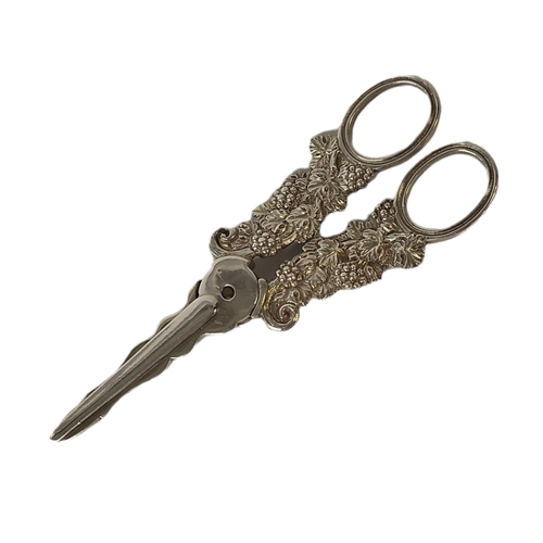 13 - A PAIR OF GEORGIAN SILVER GRAPE SCISSORS
Loop handles with vine leaves and berries decoration, hallm... 