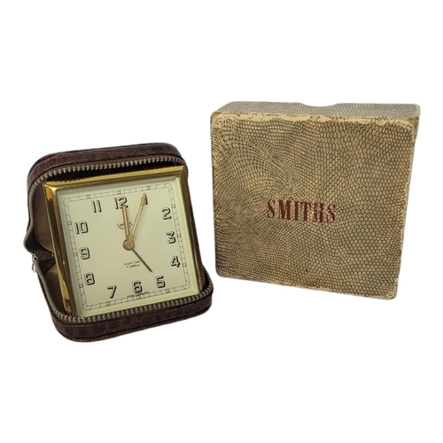 1a - AN EARLY 1950’S SMITHS OF CRICKLEWOOD EIGHT DAY TIMEPIECE TRAVELLING ALARM CLOCK
7 jewels, with Art ... 