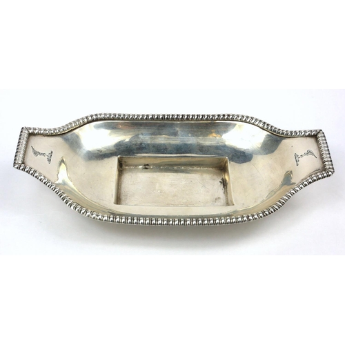 24 - A GEORGIAN PROVINCIAL IRISH SILVER INKWELL STAND
Gadrooned to borders, with infrared family crests, ... 