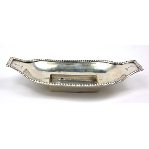 24 - A GEORGIAN PROVINCIAL IRISH SILVER INKWELL STAND
Gadrooned to borders, with infrared family crests, ... 