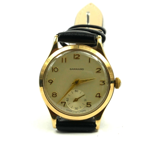 26 - GARRARD, A VINTAGE 9CT GOLD GENT’S WRISTWATCH
Silver tone dial with gilt number markings and subsidi... 