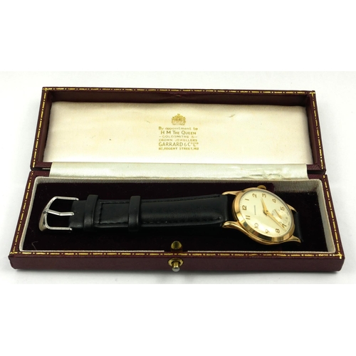 26 - GARRARD, A VINTAGE 9CT GOLD GENT’S WRISTWATCH
Silver tone dial with gilt number markings and subsidi... 