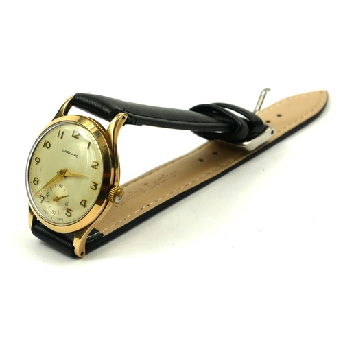 26 - GARRARD, A VINTAGE 9CT GOLD GENT’S WRISTWATCH
Silver tone dial with gilt number markings and subsidi... 