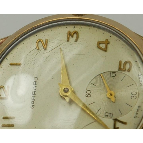 26 - GARRARD, A VINTAGE 9CT GOLD GENT’S WRISTWATCH
Silver tone dial with gilt number markings and subsidi... 