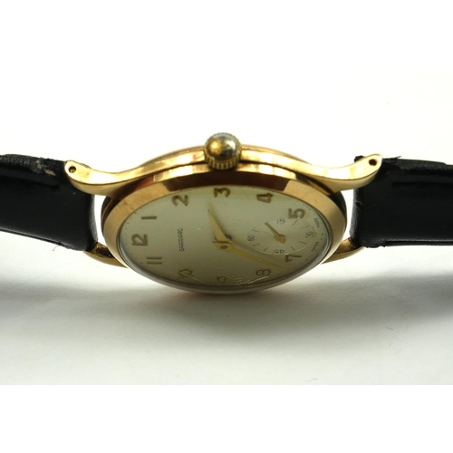 26 - GARRARD, A VINTAGE 9CT GOLD GENT’S WRISTWATCH
Silver tone dial with gilt number markings and subsidi... 