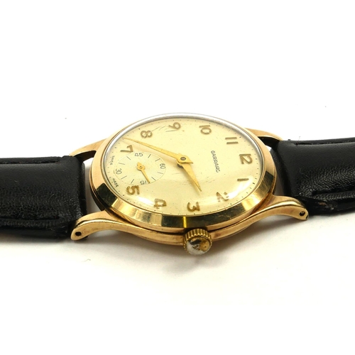 26 - GARRARD, A VINTAGE 9CT GOLD GENT’S WRISTWATCH
Silver tone dial with gilt number markings and subsidi... 