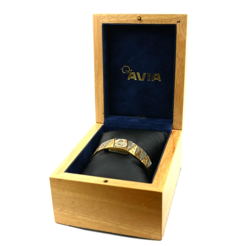 29 - AVIA, A VINTAGE BICOLOUR GOLD PLATES LADIES’ WRISTWATCH
On an integral bracelet strap, in original b... 