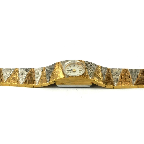29 - AVIA, A VINTAGE BICOLOUR GOLD PLATES LADIES’ WRISTWATCH
On an integral bracelet strap, in original b... 