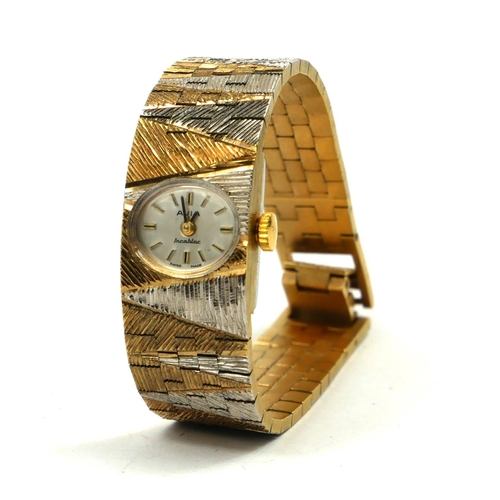 29 - AVIA, A VINTAGE BICOLOUR GOLD PLATES LADIES’ WRISTWATCH
On an integral bracelet strap, in original b... 