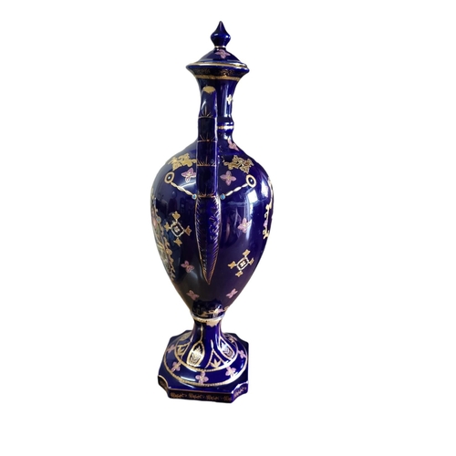 30A - A 20TH CENTURY CONTINENTAL POTTERY URN FORM VASE AND COVER
Twin handled, with transfer printed figur... 