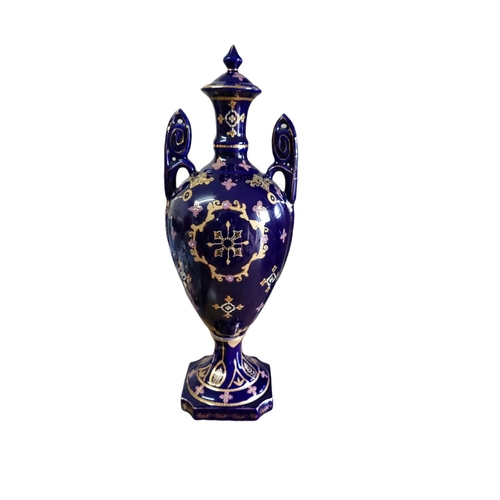 30A - A 20TH CENTURY CONTINENTAL POTTERY URN FORM VASE AND COVER
Twin handled, with transfer printed figur... 