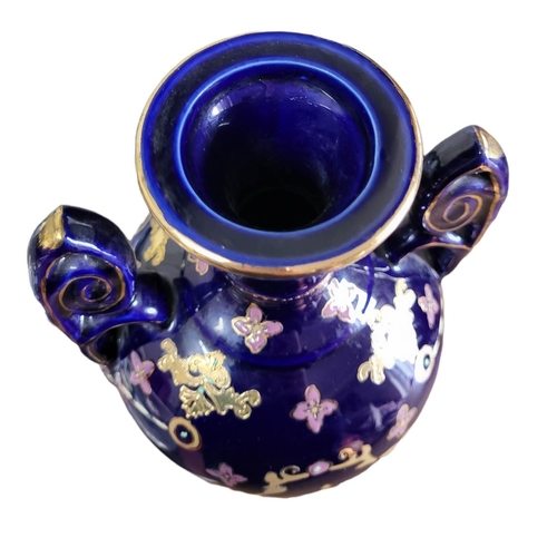 30A - A 20TH CENTURY CONTINENTAL POTTERY URN FORM VASE AND COVER
Twin handled, with transfer printed figur... 