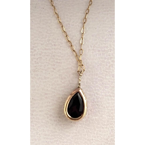 37 - A VINTAGE 9CT GOLD AND GARNET PENDANT NECKLACE.
(approx weight just under 1g, pendant length 0.5cm) ... 