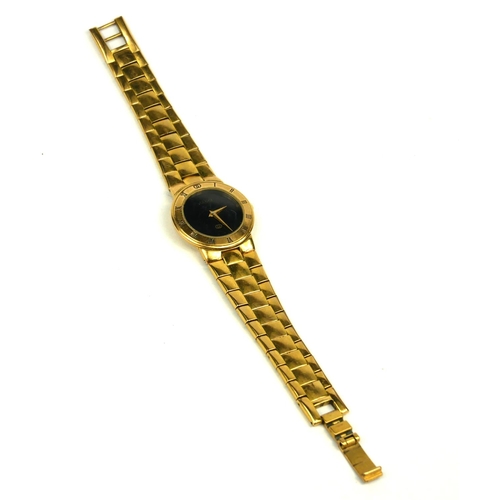 4 - GUCCI, A VINTAGE GOLD PLATED LADIES’ WRISTWATCH
The circular black dial with integral bracelet, mark... 