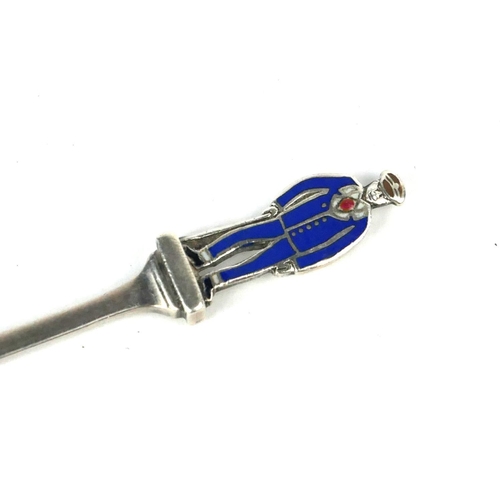 67 - LIBERTY & CO., A RARE GEORGE V PERIOD HALLMARKED SILVER PRESENTATION AMPUTEE SPOON
Having a blue ena... 