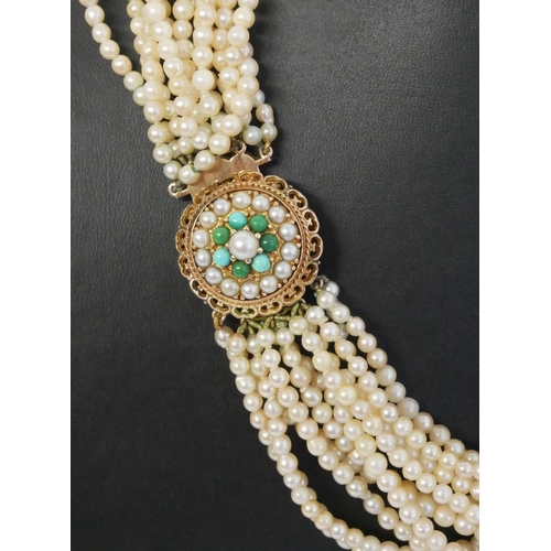 77a - A MID 20TH CENTURY FRESHWATER PEARL NECKLACE 
Having a 9ct yellow gold circular pierced clasp, decor... 