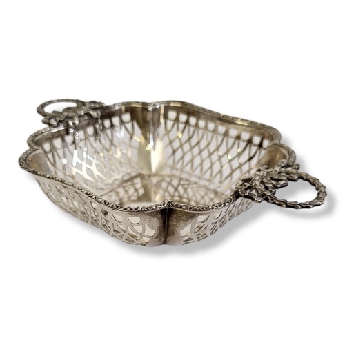 21 - AN EDWARDIAN SILVER SWEETMEAT BASKET
Twin classical laurel form handles and pierced decoration, hall... 