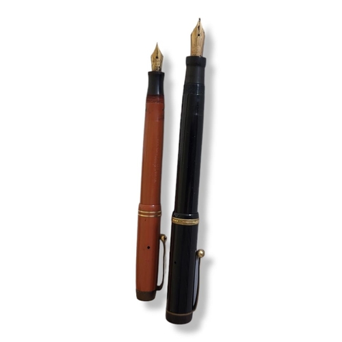 32 - TWO EARLY 20TH CENTURY PARKER 'DUOFOLD' FOUNTAIN PENS
Black cased pen marked 'Geo. S. Parker Toronto... 