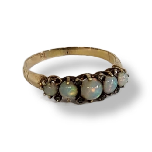 6a - AN EARLY 20TH CENTURY 18CT GOLD, OPAL AND DIAMOND FIVE STONE RING
The row of cabochon cut stones int... 