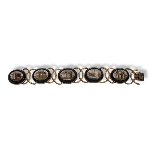 10 - A 19TH CENTURY YELLOW METAL AND MICRO MOSAIC BRACELET
Having five oval form pictorial mosaics set in... 