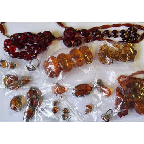 16a - A COLLECTION OF VINTAGE AMBER AND FAUX AMBER JEWELLERY 
To include two faceted bead necklaces, white... 