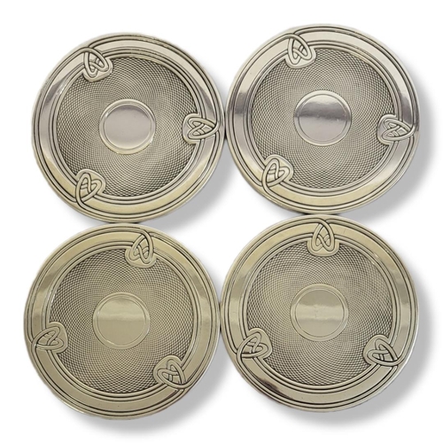 20 - CHRISTOFLE, A SET OF FOUR 20TH CENTURY FRENCH SILVER COASTERS
Having a Celtic design to rim and engi... 