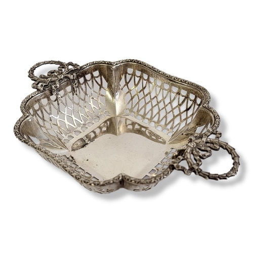 21 - AN EDWARDIAN SILVER SWEETMEAT BASKET
Twin classical laurel form handles and pierced decoration, hall... 